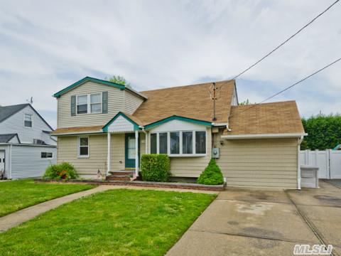 Great Expanded Cape In The Village! This Home Offers Updates That Include Roof, Siding, Windows, 200 Amp Elec, Inground Sprinklers And More! Eat In Kit W/Oak Cabinets, Corian Counters & Ss Appliances. Formal Dining Rm W/Skylight. Hardwood Floors. Call Today For A Private Viewing.