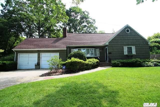 This One Has It All!  4 Large Bedrooms,  Walk In Closets,  Beautiful Hardwood Floors,  Gas Fireplace And More.  2 Car Garage And Full Basement  Plus Enclosed Back Porch Going Out To Patio & Landscaped Yard.  In Ground Sprinklers,  30 Year Architectural Roof,  Thermopane Windows And Newly Painted Exterior.