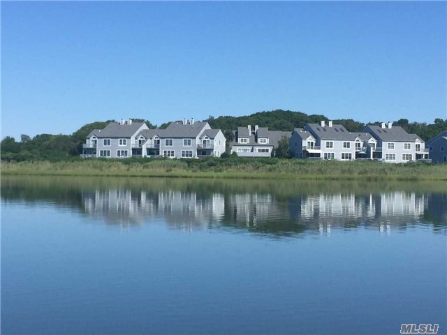 Waterfront, Panoramic Views. Boat Slip Available. Small Hidden Gem Of Community Only 33 Units. Waterfront Private Decks On Main Living Area And Master En-Suite. Work Out Area And Man Cave.  Wood Floors, Many Updates. Kayak, Swimming, Tennis Courts, Heated Pool. Located On Corey Creek, Minutes To Peconic Bay.