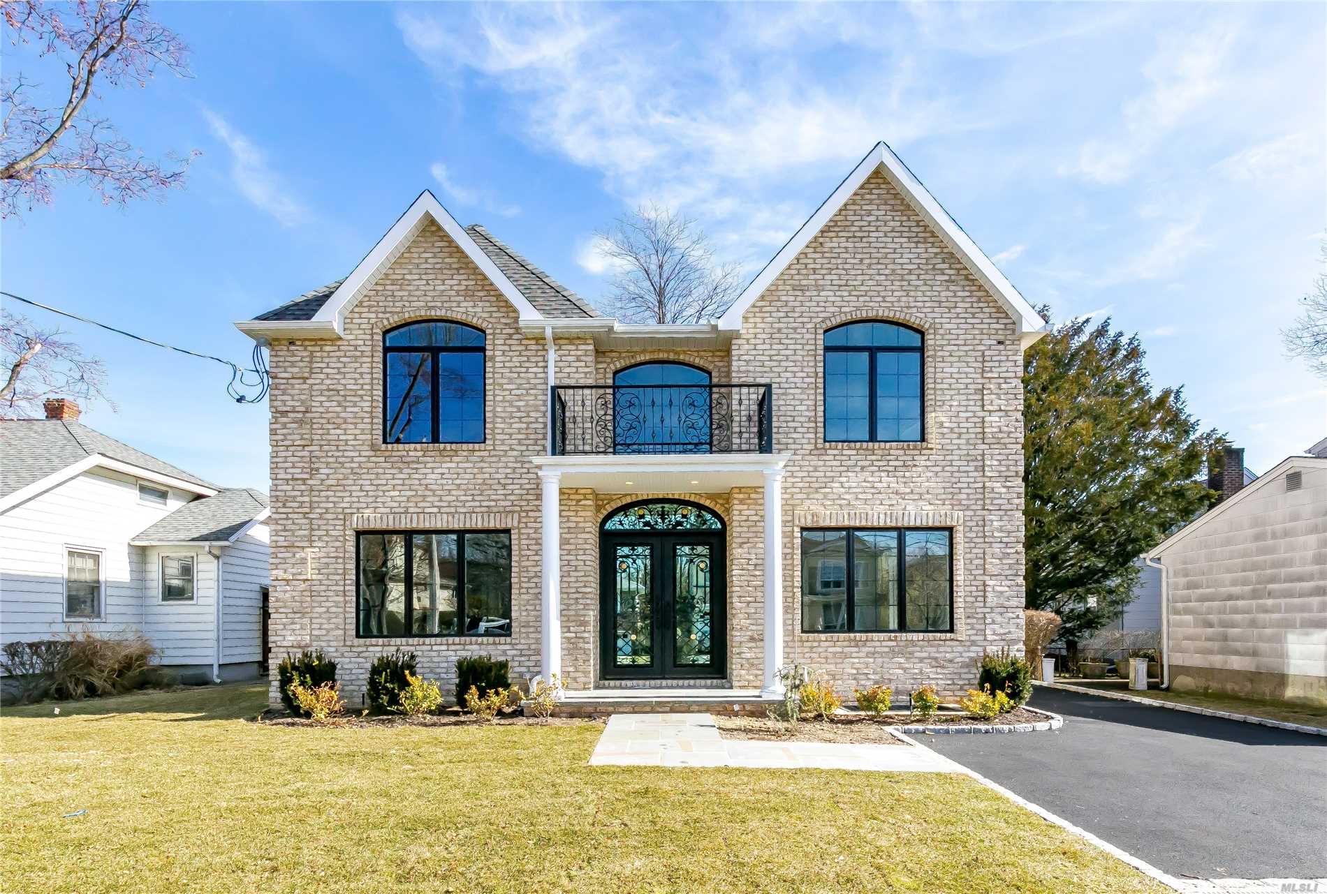 New Const. Energy Star All Brick Col, Mid-Block Loc On Oversized Lot. Top-Of-The-Line Amenities,  4.5 Designer Baths, Completely Finished Bsmt W/Br, Bth, & Large Playroom W/Staircase To Backyard. Pella Windows Throughout, Roslyn School District.