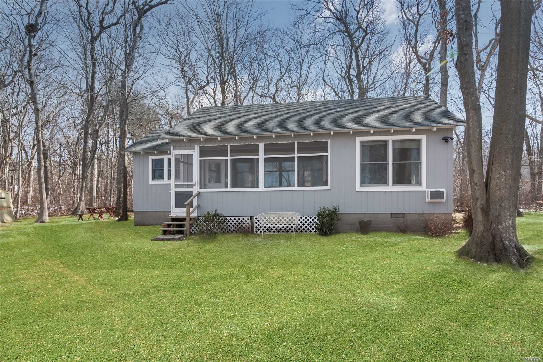 Peaceful Lakefront Cottage On A Shy Acre With Privacy Galore. Paddle To Neighboring Peconic Dunes County Park, Or Enjoy A Short Bike Or Stroll To Beautiful, Sandy Kenney&rsquo;s Beach In Southold. Room To Expand And Quick And Easy Access To Southold And Greenport. Your Perfect North Fork Getaway Awaits.