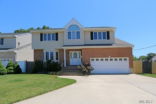 Spacious Young & Bright Colonial With Circular 4 Car Driveway, Over Sized Fenced Rear Yard With Patio, Huge Eat-In-Kitchen With Pantry, Open To Large Den, Formal Dining Room, 2nd Floor With 3 Large Bedrooms, Full Bath, Master With Bathroom & Walk-In Closet, Amazing Truly Full Finished Basement. 2.5 Gar Garage, Gas Heat & Cooking. Must See!