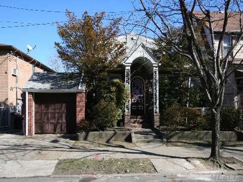 Detached Brick One Family Home Features Three Bedrooms, Two Bathrooms, Living Room W / Fireplace, Dining Room, Eat-In Kitchen, And A Full Basement. 40 X 100 Lot Size. One Car In Front Of House And One Car Garage In Backyard That Is Good For Storage. Home Needs Modernizing.