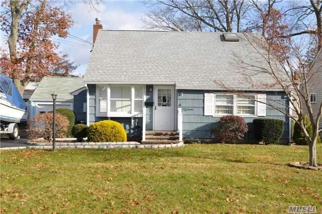 Meticulously Maintained Cape. Offers 3 Or 4 Bedrooms, Living Room & Eat-In-Kitchen With Gas Cooking. Screened In Porch & Two Full Baths. Detached Two Car Garage With Workshop & Plenty Of Attic Space. Updated Roof, Siding, Electric, Heating (On Demand),  Driveway & Wood Floors Thru-Out. This Gem Will Not Last Long So Call Today For Details.