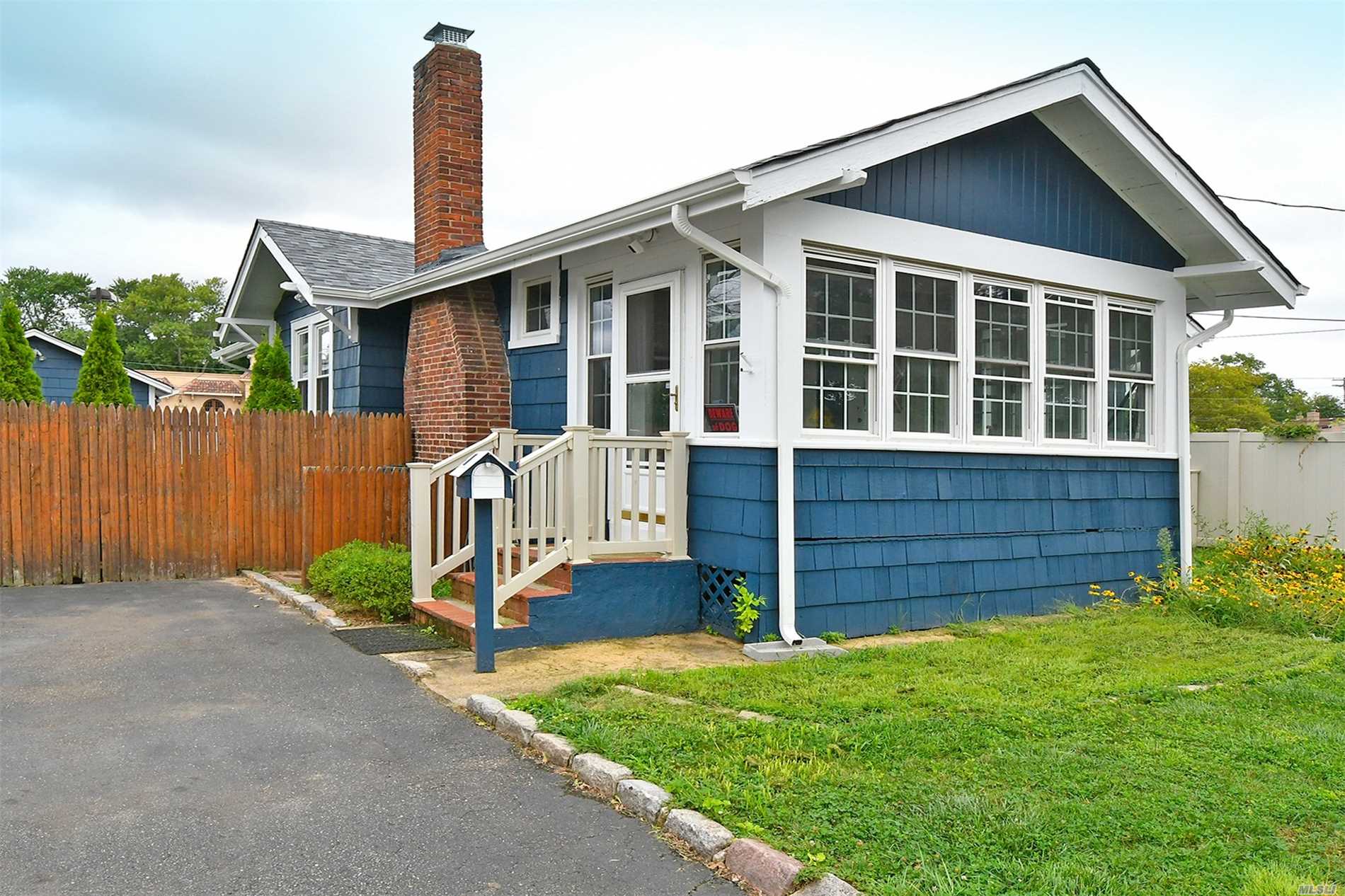 Move Right Into This Charming Ranch Home W/ 2 Beds & 2 Baths, Updated Galley Kitchen W/ Cherry Cabinets, Granite Counters & Stainless Appliances. Large Living Room W/ Hardwood Floors, Vaulted Exposed Wood Ceilings & Wood Burning Fireplace. Sunny Enclosed Porch, Almost New Roof, Windows & Cac, Updated Electric, Private Fenced In Yard W/Patio & In-Ground Sprinklers, Low Taxes!