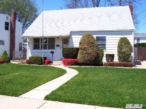 This Charming Cape Boasts Newly Renovated Eat In Kitchen With Corian Counters-Ss Appliances-Center Island. First Floor Redesigned To Include Formal Dining Room And Open Floor Plan -Hardwood Floors Throughout- Finished Basement- Stratford Elementary.