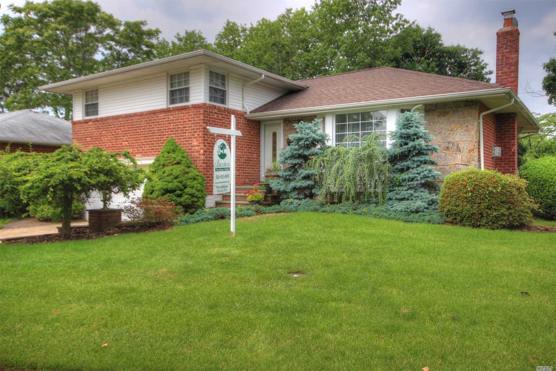 &rsquo;&rsquo; Please Note, Taxes Successfully Grieved & Are Being Reduced For Year 2019/2020 By 34.13% Brick Split In Move In Condition W/Mid Block Location, Features Open Floor Plan W/Updated Granite Eik, Living Room W/Gas Fire Place, Dining Room W/Access To Deck, Family Room, Master Bedroom With Full Bath, Wood Floors Thru-Out, Cac, Updated Windows, Newer Hot Water Heater, 4 Zone Igs, 2 Car Garage. Much More. !!!This Is A Very Nice House. Must See!!!