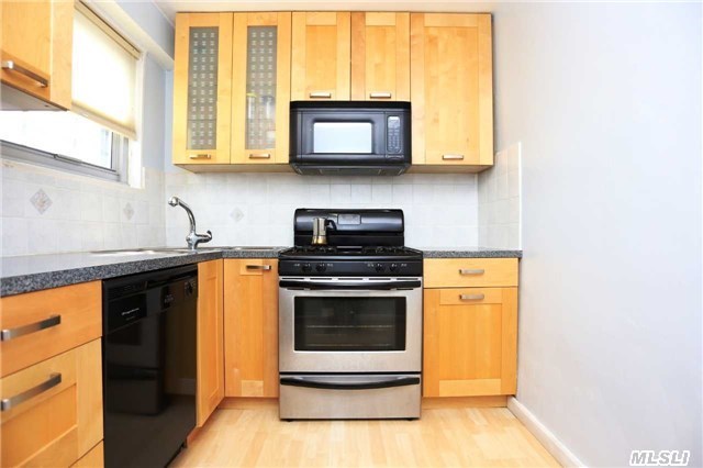 Beautiful Large One Bedroom Coop. Featuring A Foyer W/Closet Space. Well Kept Kitchen With Wood Cabinets And Stainless Steel Appliances. Huge Living Room That Leads You To A Terrace Great For Extra Storage Space. Doorman And Laundry In Building. Community School District 28. Less Than .1 Miles To E & F Train.