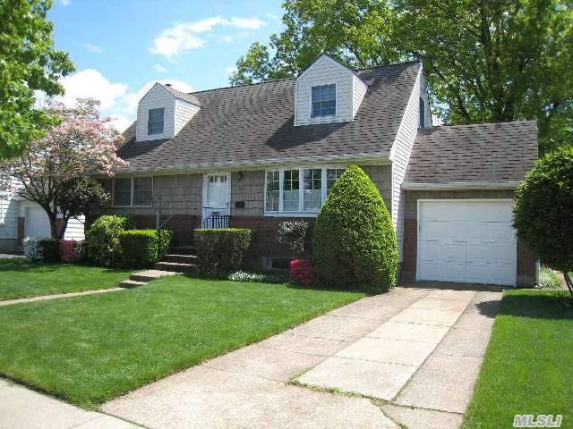 Nantucket Cape Cod Charmer. Sunny & Bright Home With Custom  Bay Windows In Lrm & Drm. 2 Full Baths & 4 Bdrms With. Doggie Dormers In Front!  Rear. Fenced Park Like Yard With Extra Little Plot Of Land For Storage Shed Or Swing Set! Borders Jericho With Hicksville Schools.. Gas Cooking,  Full Bsmt & Attached Garage! Close To All Transit And Shops! Hurry On This One!