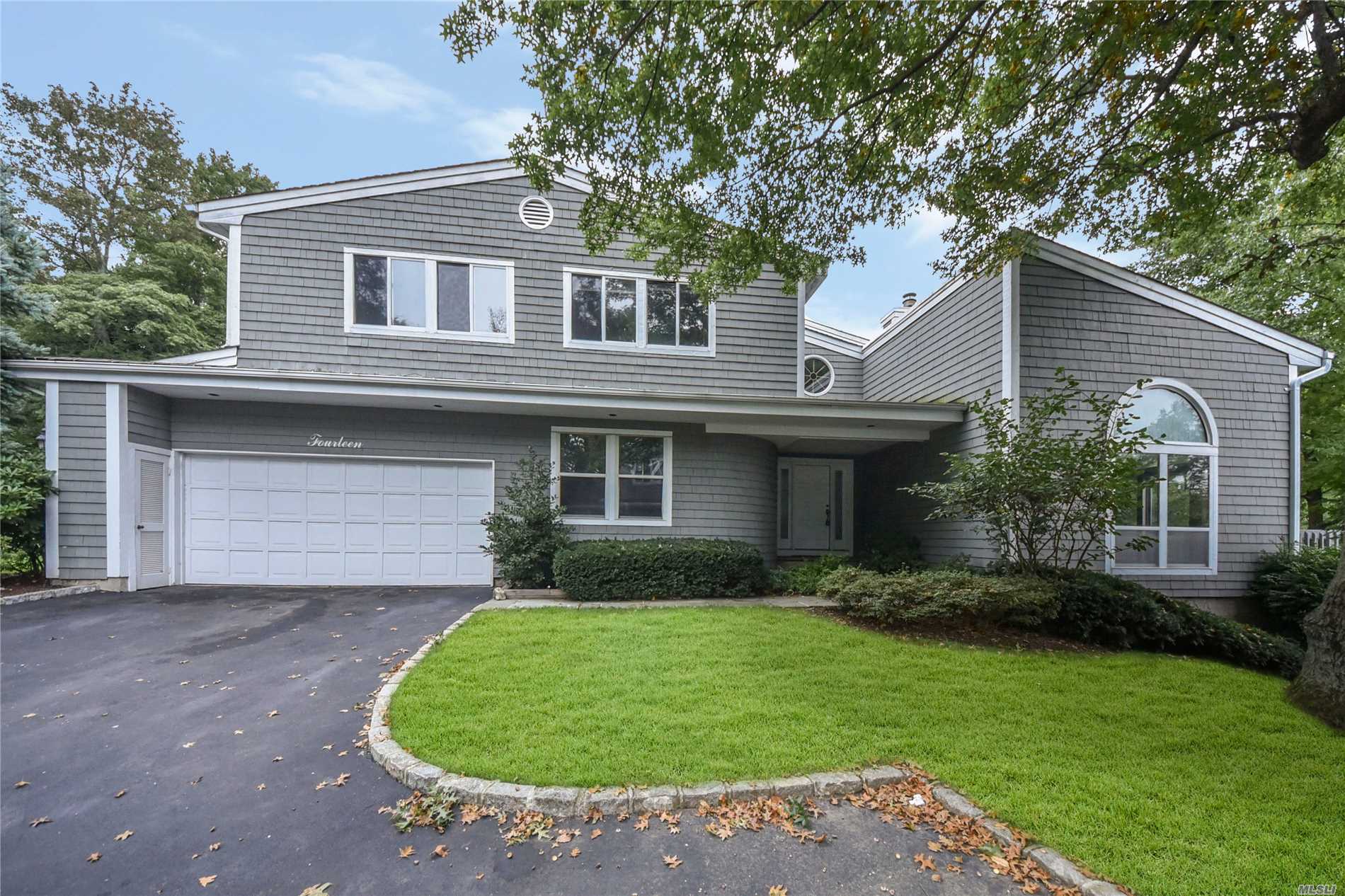 Manhasset. Premier Location In One Of The Most Desired Developments With Sunken Living Room With Built-Ins And Fireplace, Formal Dining Room, And Huge Kitchen. Walk Out Basement Has 2 Bedrooms, Full Bath, Summer Kitchen And View Of The Pond.