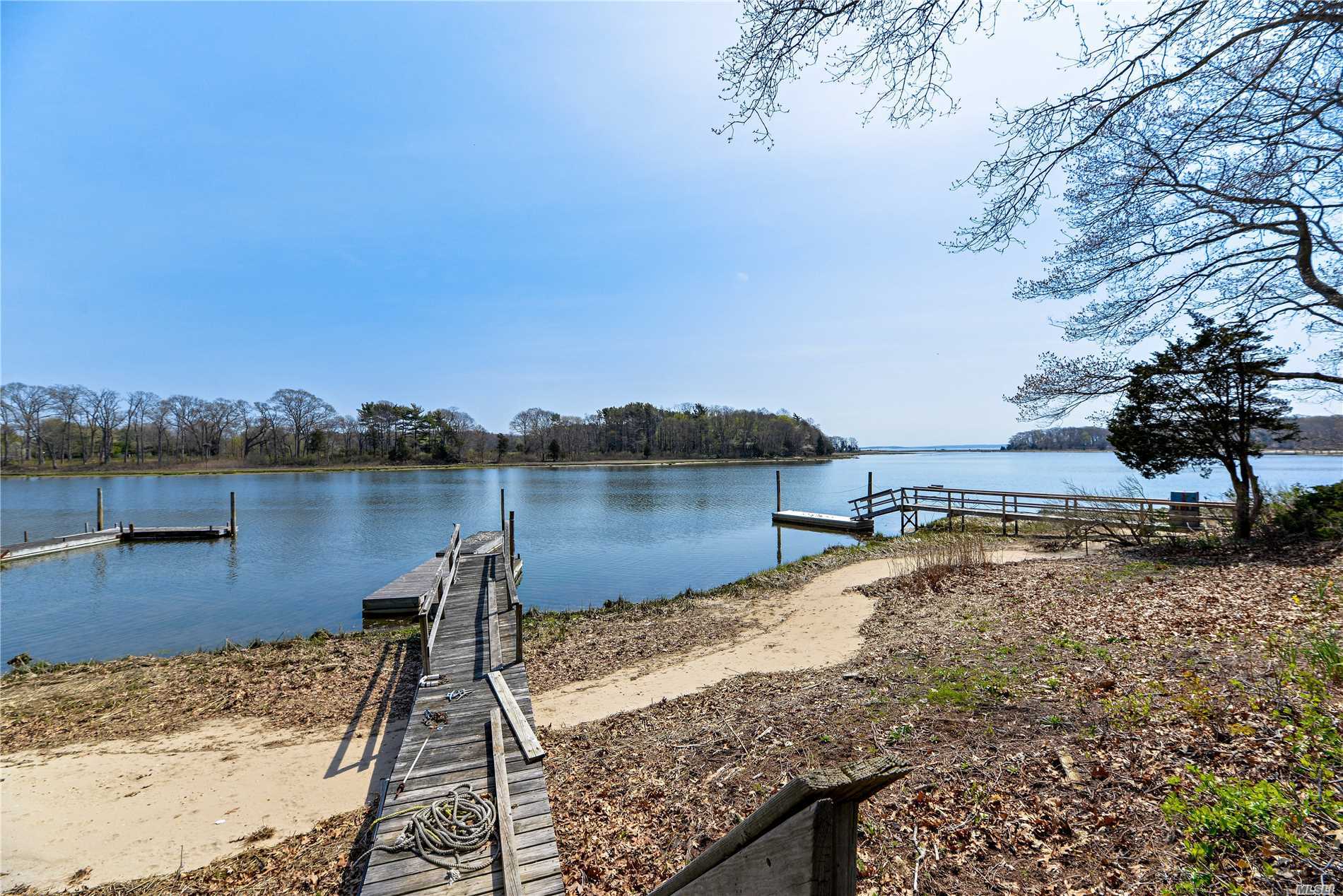 Location Says It All! 60&rsquo;S Ranch, Waiting To Be Re-Imagined. 2 Bed. 1.5 Ba. 110 Feet Of Sandy Richmond Creek Front. Dock W/Deep Water Access To Peconic Bay. 2 Fireplaces. Hardwood Floors. Vast Views Of Mouth Of The Creek And Bay Beyond.
