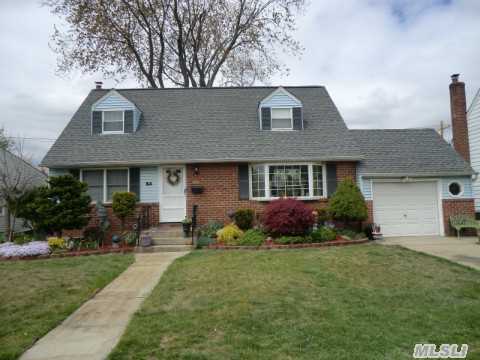 Welcome To This Large Center Hall Cape!Featuring An Open Sun Fillled Layout W/Eik,  Dining Room,  4 Nice Sized Bedrooms,  2 Baths And A Finished Basement. A Large Covered Wood Deck To Enjoy Your Evenings. Don't Miss This One! It's Priced To Sell And In Time For You To Enjoy Backyard Bbq's With Family And Friends! This Home Is Back On The Market! Don't Miss This Out Again!