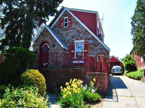 Brick/Stone Tudor Cape In Bayside Hills. Large Living Room With Cathedral Ceiling. Formal Dining Room, Finished Basement. School Distict #26. Walk To P S 203 And Cardozo High School. 