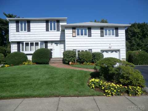 Follow The Tranquil Tree Lined Street To This Stately House. Surrounded By Beautiful Parklike Property With Oversized Redwood Deck. Adding To The Splender Of This Expanded House-Cabinet Lined Expanded Eat-In-Kitchen With Sliders To Huge Deck. Expanded Formal Dining Room. Sunfilled Livingroom, Laundry/Mud Room, 5 Large Bedrooms With 2.5 Baths.Don't Miss This One!