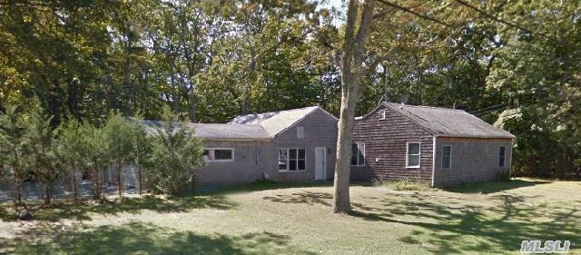 Get In To The Exclusive Area Of East Hampton! This Charming Ranch Is Set On A Flat Lot And Boasts Hardwood Floors Inside.