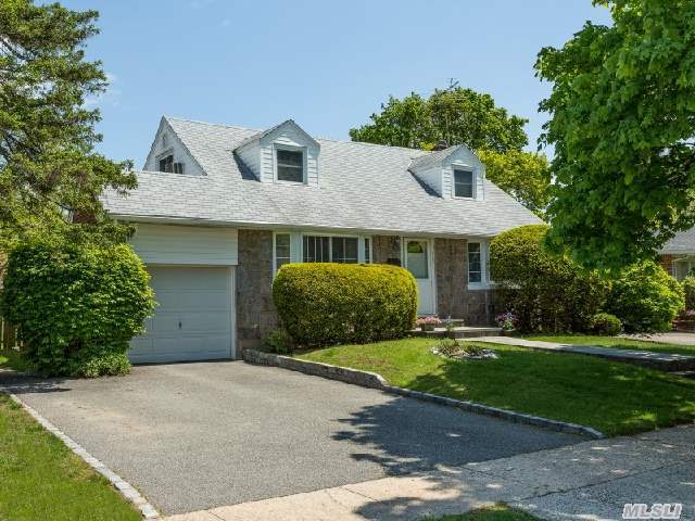 Immaculate 4 Bedroom 2 Bath Cape In Oakwood Estates Section Of Jericho. Hardwd Flrs,  New Windows. Flr ,  Fdr. Sunny Expanded Eik,  Skylights,  Gas Cooking,  Mstr On Main,  Finished Bsmt,  One Car Garage,  Great Yard,  Award -Winning Jericho Schools.