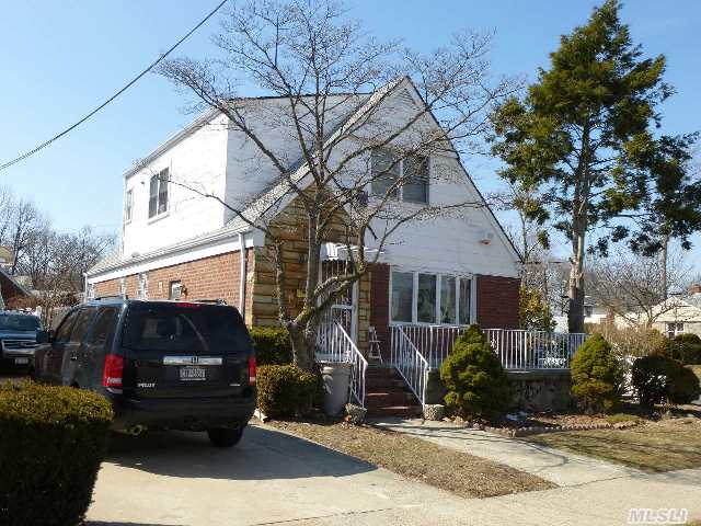 Location ! Location !  Perfect Mother & Daughter House,  Excellent Condition,  4 Bedrooms,  3 Baths,  Expanded 2nd Floor,  Updated Basement W/ Full Bath,  Family Room,  Extra Room,  Hard Wood Floor Throughout,  Updated Roof. School District 26,  Ps 46,  Ms 74,  Cardozo Hs,  Convenient For  Shopping & Transportation,  Q27/28,  Qm3.