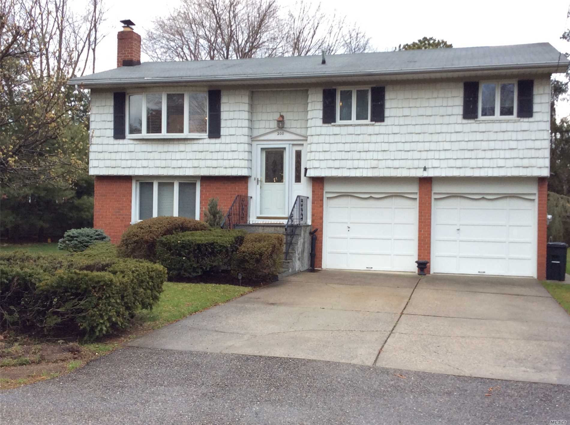 Lovely Home On A Private Cul De Sac In Half Hollow Hills Schools (Otsego Elem/Candlewood, Hs West). Great Sized Property - .41 Acre (Huge Yard). Hdwd Flrs Main Lvl.  House Features Igs, Covered Two-Level Deck, Light And Bright Eik, Newer Windows Some Andersen, 2 Car Garage, And 2 Updated Baths. Great Fam Rm W/Fpl. Bar/Sitting Area With Wet Bar/Fridge. Minutes To Lirr, Shopping And More.