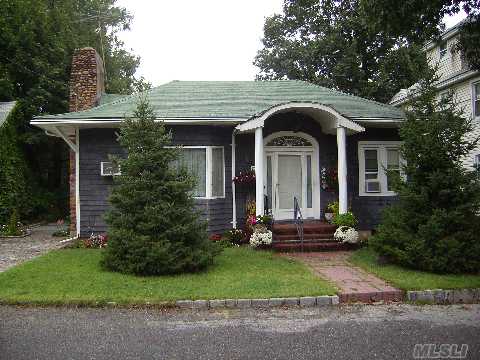 Charming Ranch Featuring A Large Living Room With A Fireplace, Formal Dining Room, Tiled Kitchen, Tiled Full Bathroom, And Three Bedrooms. A Deck From The Kitchen Overlooks Large Private Gardens. Plenty Of Storage. This Is A Wonderful Opportunity For First Time Home Buyers To Settle Into The Renowned Roslyn School District.