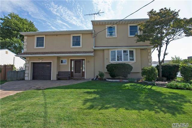 Massapequa Shores Expanded Colonial. Chef's Eik, Den W/Brick Fpl, Great Rm W/Cathedral Ceilings, 5/6 Brs, 2.5 Bths, 1 Car Garage, In Ground Pool. Meticulously Landscaped. New State Of The Art Solar System.