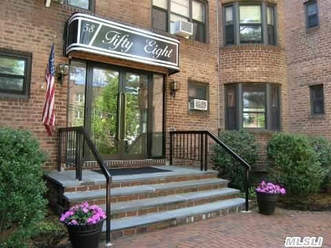 Contract Cancelled - Now Available - Rare Over-Sized Unit In A Very Desirable Building. Professionally Decorated On The 3rd.Floor. Light,  Bright And Dynamite. Hi-Line Kitchen With Granite,  Stainless Steel,  Hardwood Cabinets,  Ceramic & Hardwood Floors,  Lots Of Organized Closets. Close To Long Island Railroad,  Village And Community Park. Just Beautiful. Move Right In