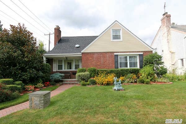 Mott Section Of Mineola,  Solid Brick Cape 3/4 Bedrooms,  Formal Dining Room,  Large Eat-In Kitchen,  2.5 Baths,  Full Finished Basement,  Hardwood Floors,  2 Car Garage,  Roof,  Boiler And Bath Have Been Updated With In The Last Few Years. Close To Shopping And Transportation.  Don't Miss This One.