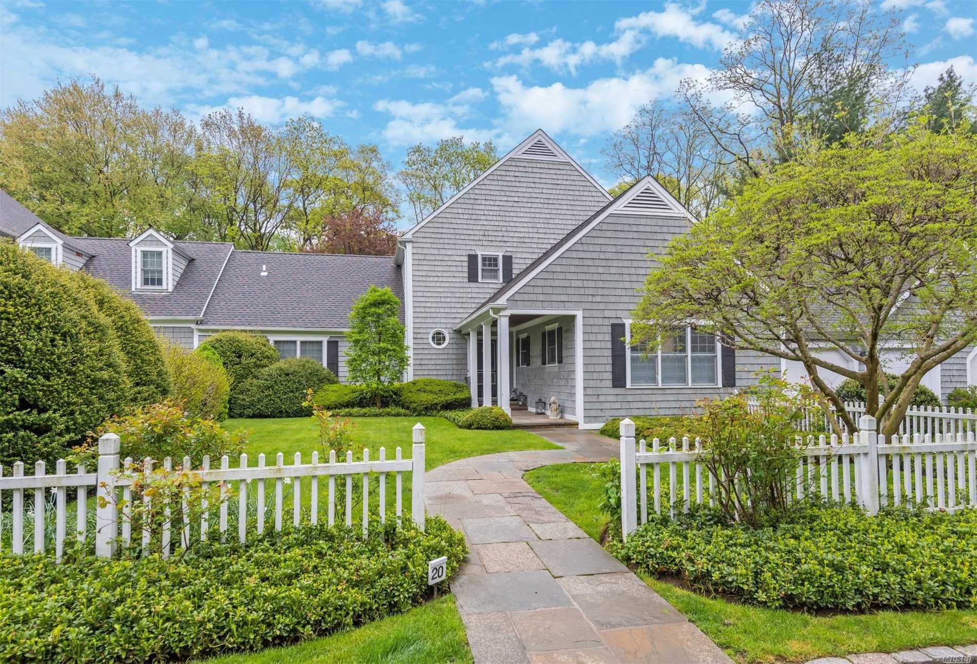 Renovated Nantucket style home with formal gardens, backing a preserve offering a serene and quiet setting. A gracious entrance and elegant entertaining rooms all overlooking wonderful gardens. Features include a new Gourmet Kitchen with walls of cabinetry, center island, calcutta marble countertop & top of the line appliances, service bar area to match, 2 Master Ensuite Bedrooms with new baths & spacious outfitted closets, 20 Kw Generator, 2013 Hot H20 Htr & Furnace, Updated roof, HOA