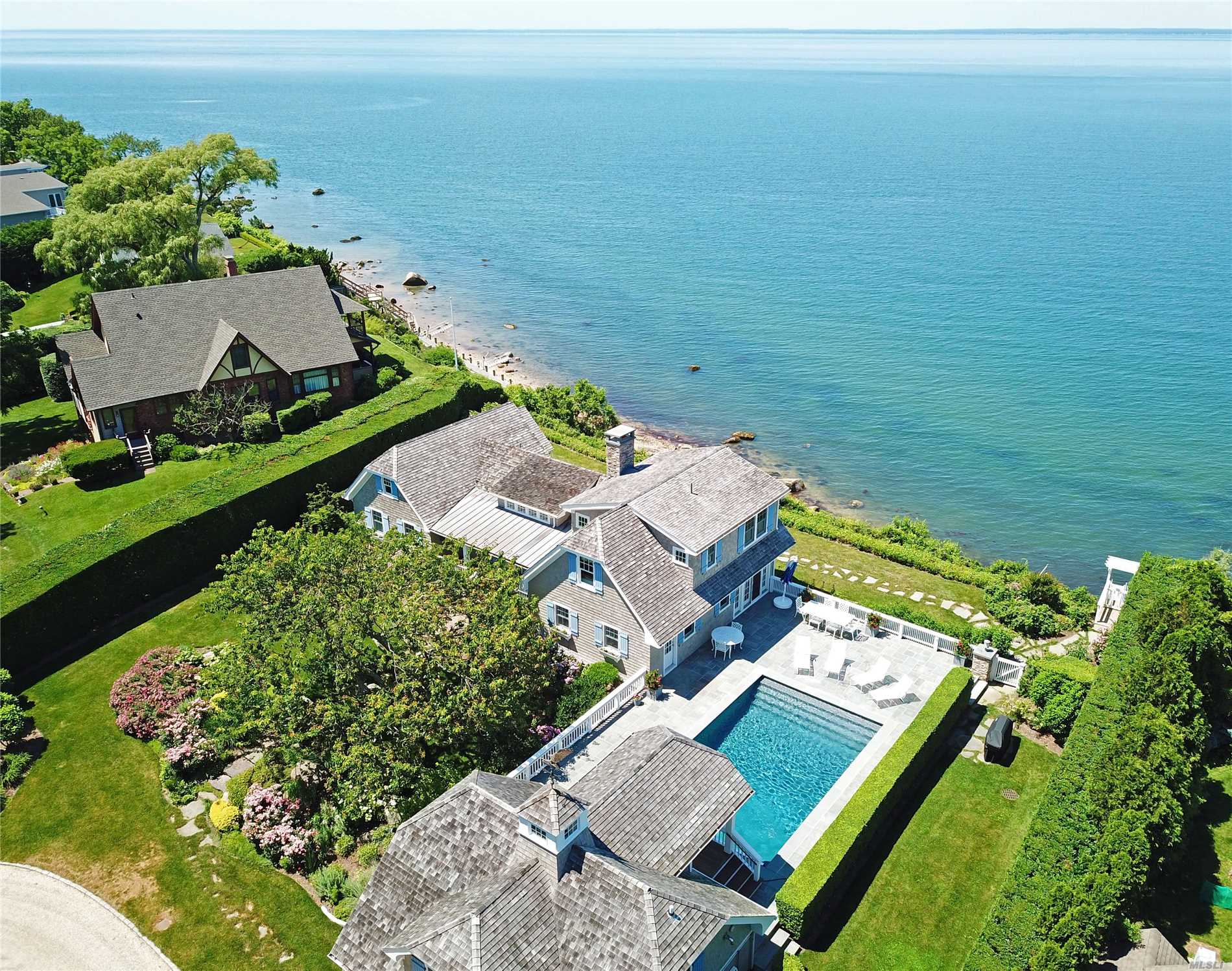 Simply Exquisite Pristine Nantucket Style Waterfront Compound Adorns Bluffs Sitting High Above Li Sound. The Chic Main House With Gourmet Kitchen And Double Sided Fireplace And Separate Pool House Are Built Around The Common Outdoor Recreational Areas, Gunite Heated Pool,  Blue Stone Patio, , Bar-B-Que, And Staircase Leading To 148 Of Beachfront.