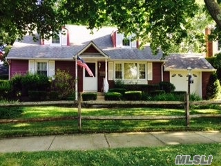 Charming Rear Dormer Cape Situated On Beautiful Block In Bethpage, Sd#21, Great Curb Appeal W/Vinyl Sided Ext, Portico, Lr & Dr W/ H/W Flrs, Country Eik W/Built-Ins, 2nd Fl: Lg Br, Semi Finished Rm For Bth. Fin Familly Rm Bsmt W/Custom Built-Ins & Bar, All Windows Have Been Replaced, Priv Fenced Bckyrd, Deck, Igs