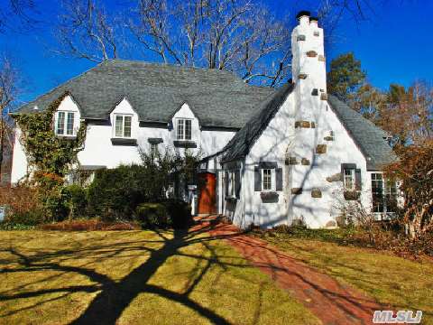 Russell Gardens One Of A Kind Stucco Colonial. Dramatic Formal Lr With Tall Cathedral Ceiling,  Open Floor Plan,  Totally Renovated. Fabulous Den With Stairs To Additional Family Room,  State Of The Art Eik,  Viking Appliances,  Farm Sink,  Guest Room On Main With 1.5 Baths.Sun Room,   Nothing Short Of Fabulous. Sunny Interiors With Flat Over 1/3 Park Like Grounds