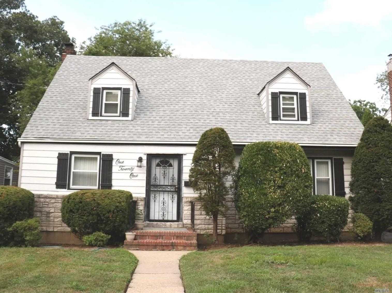 Spacious dormered cape on quiet tree lined street. 5 Bedrooms, 2 baths and full basement with tons of potential. New Roof, New updated kitchen with stainless steel appliances, formal dining room and bright airy living room. Lowest taxes in Hempstead. Great Price. Show easy