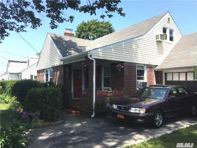 **All Binders Off***Charming Cape In Hicksville, Part Brick, And Vinyl Siding, New Windows, Cozy Living Room With Working Fireplace. Located Minutes From The Lirr. Hurry!! Won't Last! (Includes Additional Lot # 1)