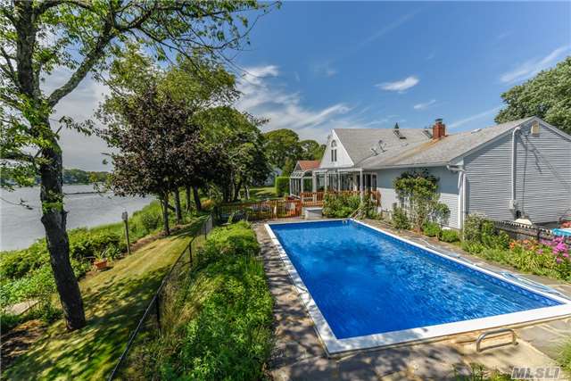 Beautifully Maintained Waterfront Home With Dock And Waterside Inground Pool On East Creek In Cutchogue. Features An Updated Kitchen, Sunroom, Hardwood Floors, Central Air Conditioning And More. Minutes To Beaches, Vineyards, Farmstands, And Dining. North Fork Summer Fun Is Ready And Waiting For You.