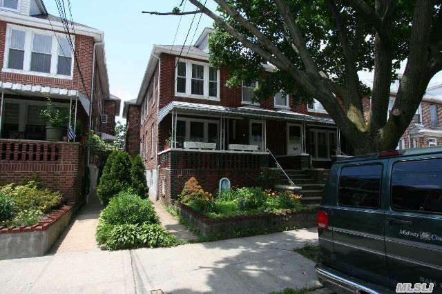 Semi-Detached Brick Two Family Home In Neat And Clean Condition. Three Bedroom Apt. Over Two Bedroom Apt. And A Finished Basement With Bathroom. Gas Heating System. Two Car Garage. Won't Last!!!