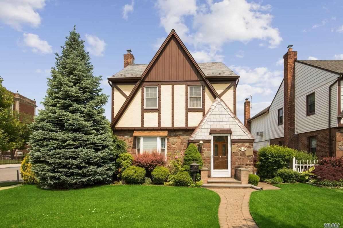 All information provided is deemed reliable, but is not guaranteed and should be independently verified. Welcome home to this brick detached 1 family tudor in Bellerose. This corner property features an enclosed glass sun room off the private yard perfect for realxing on a lazy Sunday afternoon. The formal dining room, large livingroom, eat-in-kitchen , 3 berooms and a full finished basement compliments the home. There is a private detached garage and private driveway