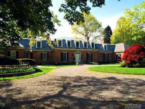 Entered Off A Quiet Cul-De-Sac By A Tree-Lined Drive & Circular Courtyard, The Graceful Brick French Provincial Manse With Slate Roof & Massive Dentil Crown Molding Is Ensconced On 4.56, Lush Secluded Old Westbury Acres.Classic Style With Elegant French Influences.Taxes To Be Reduced Approx.10% 2012/13 & A Further Reduction 2013/14 Letters On File.  