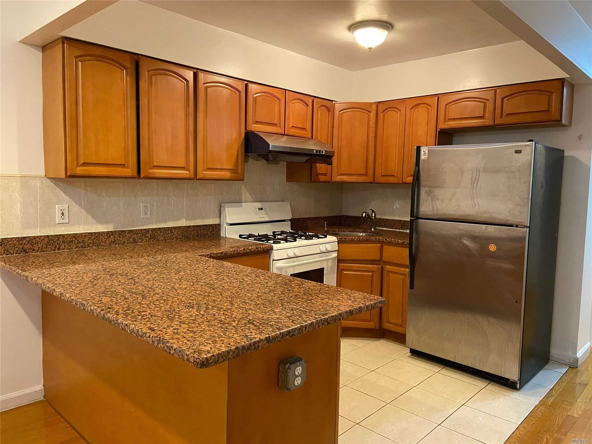 Spacious Apartment Features Large Eik With Granite Counter Tops And Island, 3 Bedrooms, 2 Full Bath, 2 Walk In Closets In Master Bedroom, 2 Balconies, Separate Entrance, And Hardwood Floor Throughout. Must See!