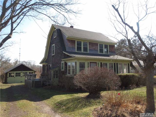 Dutch Colonial W/3 Bedrooms. Bright & Charming. Hardwood Floors, Sunny Front Porch. Garage/Studio At Back Of Property. House Sits High On 1/2 Acre With Views South Over 8 Acres Of Protected Wetland & Silver Lake. Property Has Private Backyard And 2nd Outbuilding.