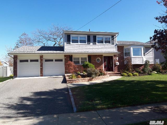 Beautiful Split Level In Nassau Shores. Oversized 85 X 100 Lot. Enter To Ceramic Tiled Foyer,  Full Bath,  Bdrm,  Fam Rm W/Brick Fplc & Home Office. 2nd Flr:H/W Floors,  Fdr,  Eik,  3rd Flr:H/W Floors, 3 Bdrms,  Mbrm W/Dual Entry To Fbath. Part Unfin Bsmt,  Cac,  Cvac,  New Heat Sys,  Washer/Dryer. 200 Amp Electric,  Pvc Fencing. 2 Car Att Garage & Prof Landscaped. Taxes W/Star $9547