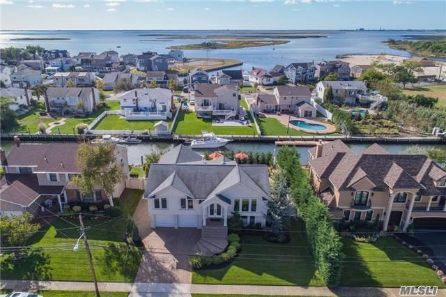 Waterfront Stunner! True Diamond! Remodeled Expansive/Open Concept! Exquisite Chef&rsquo;s Eik! Custom Cabinetry, Granite, 4.5X9 Islnd, Wolf, Sub-Zero, Miele, Wine Chillers.Huge Den/Gas Fpl/Surround Sd.Luxurious Spa Bths/Air Jet Tub, Stained Oak Flrs.Resort Bkyd!Entertainer/Boaters Paradise--Salt Igp/Fountains, Light&rsquo;g, Landscap&rsquo;g.Navy Blkhd, Helical Piles, Dock, $571Yr Fld Insur&Low Taxes!