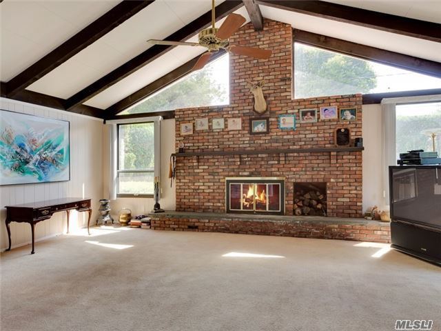 Syosset - Very Spacious Expanded Split W/Additional 20' X 26' Great Room W/Fireplace, Soaring Ceiling, Natural Light And Sliders To Deck And Inground Pool. 3 Bedrooms, 2 Full Baths, Gas Heat And Cooking, Hardwood Floors On Main Level And Bedroom Level. Cac, Igs. Roof = 5 Years Old, Pool Liner Is 3 Years Old. Convenient To Everything. Syosset Sd.