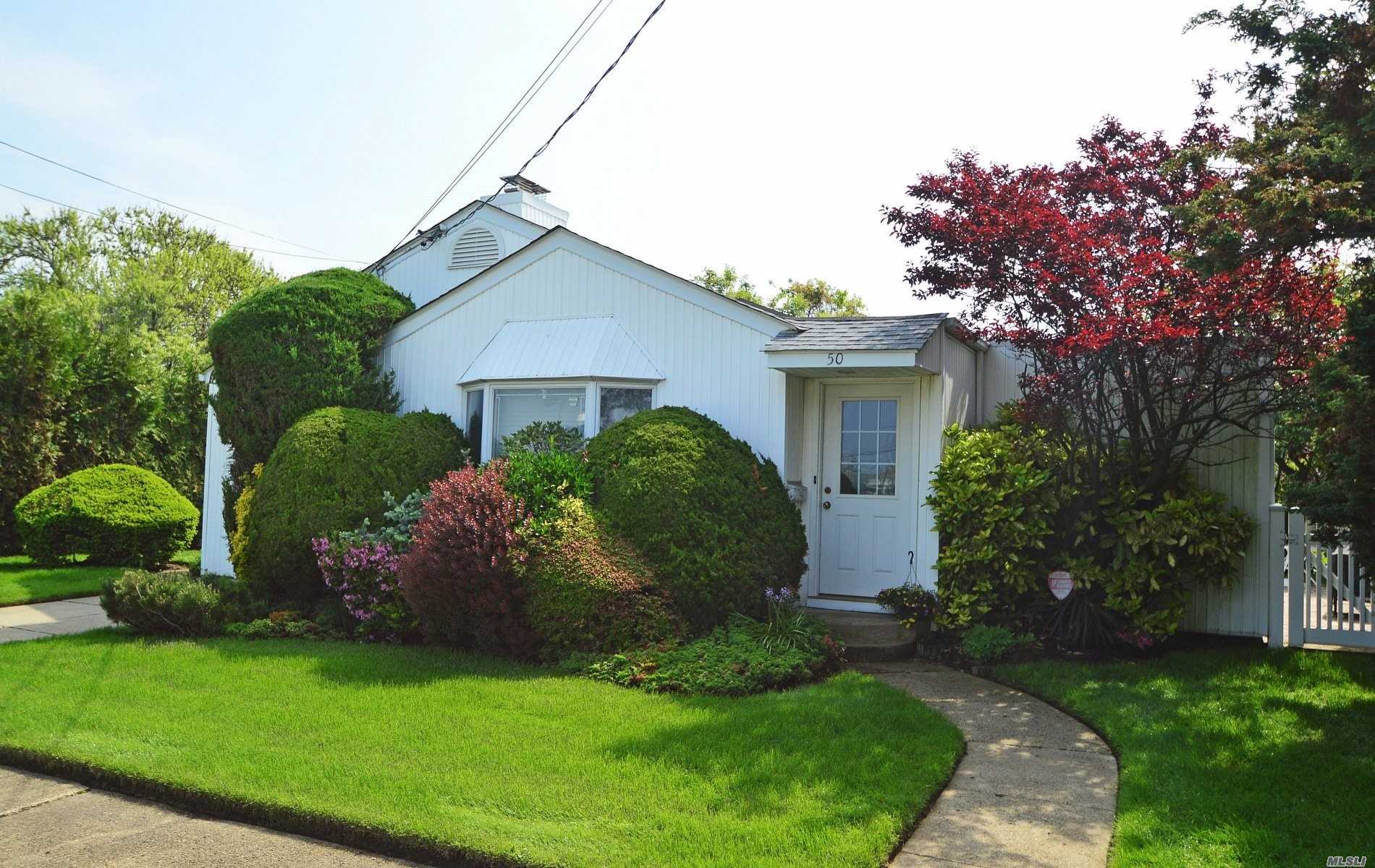 Charming Bright 3 Bedrooms 2 Bath Ranch Style Home Located On A Desirable Beach Block Just Steps To The Boardwalk And Private Beach. The Side And Rear Garden Are Stocked With Mature Trees, Flowering Shrubs And Secluded Patio For Sunbathing And Bbq's. There Is Potential To Enhance And Extend Adding A Second Floor Would Afford Amazing Ocean Vistas...Low Taxes And Parking !!!