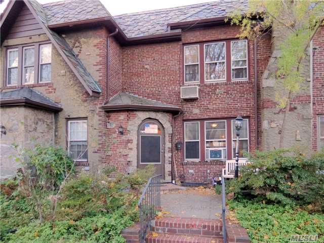 Charming Tudor Townhouse In North Flushing. 2 Minute Walk To Browne Park. Close To Supermarket, School, Bus, L.I Railroad, 2 Skylights On 2nd Floor, Two Retractable Canopies In The Back.