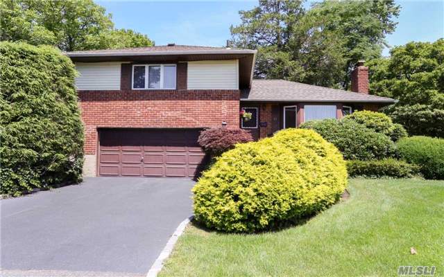 Large Light And Bright Home Located In The Upscale Community Of Syosset Woods/ Home Has All Large Rooms, Light Wood Kitchen Cabinets. Newer Stainless Appliances . Roof Less Than 5 Years Old Updated Windows Wood Floors Willets Elementary Hb Thompson Middle School Close To Shopping Highways And Houses Of Worship