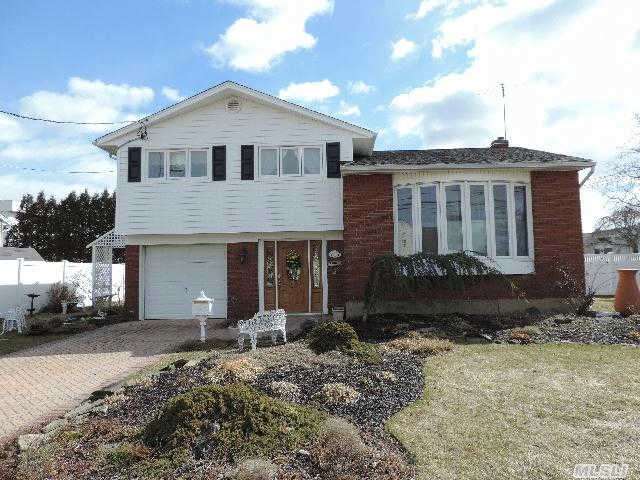 Beautiful Brick/Vinyl Split Sd#23, Updt Siding, Fenced Yard W/Shed, Rear Patio And Deck Off Kit, Lr W/Cathedral Ceiling, Eik W/Skylight, Dining Room W/Built In Cabinets, Hardwood Floors, Crown Moldings, Finished Bsmt/Playroom, Laundry And Storage, Igs, Gas Heat And Cooking, Convenient To All.