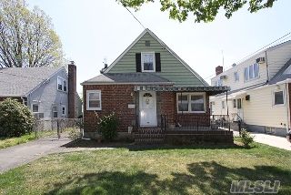 Lovely 4 Bedroom House With A Great Layout.  The First Floor Features Large Living Room, Kitchen, Dining Room, 2 Bedrooms And A Full Bath.  The Second Floor Has 2 Bedrooms And A Full Bath. There Is A Full Basement. This Home Has Hardwood Floors Throughout And The Windows Have Been Replaced.  Private Backyard With A 1 Car Detached Garage. 