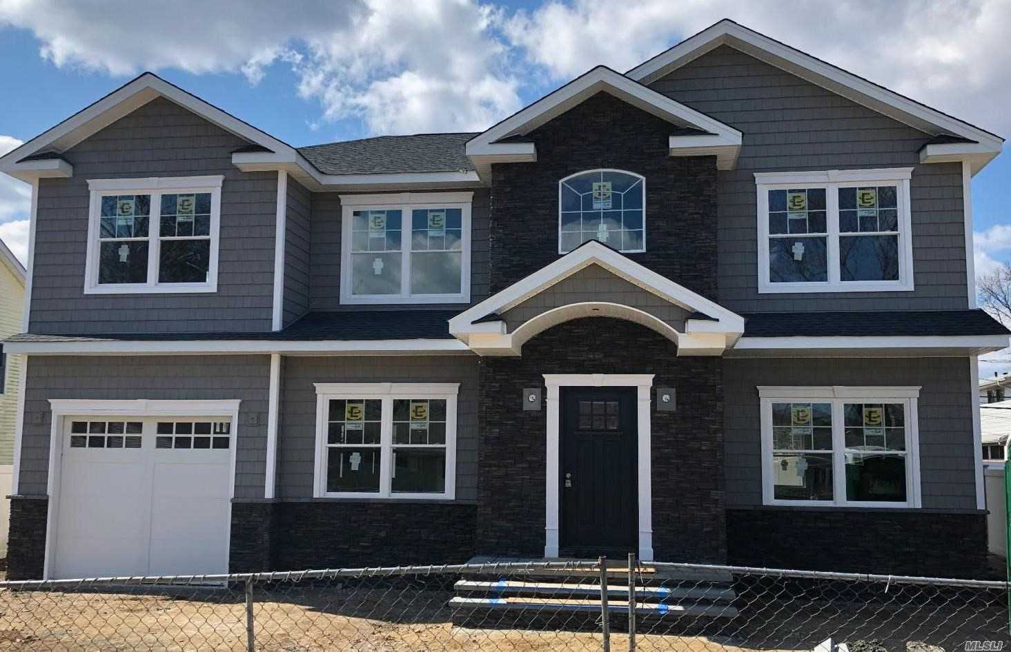 New Construction. Syosset Groves. Center Hall Colonial W/ 5 Bedrooms & 3 Full Baths. Quality Craftsmanship Throughout! Vaulted Entry, Custom Kitchen W/Granite Ci & Ss Appliances, Fdr W/Tray Ceiling, Fr W/Gas Fpl, Mstr Suite W/Bth & 2 Walk In Closets. 9&rsquo; Ceiling On 1st Flr, 8&rsquo; On 2nd & Bsmt. Gas Combi Heating Unit/2 Zone Hydronic Ha Heat/Cac, 200 Amp Elec., Prewired Cable/Cat 5E, Crown Moldings, Hi Hat Lighting, Alarm, Igs & More.