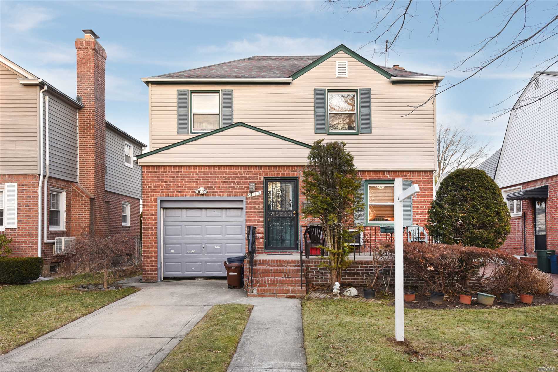 Beautiful Colonial House Situated In The Heart Of Fresh Meadows. It Features 3 Bedrooms, 2 Bathrooms, Hard Wood Floors, Finished Basement. Garage And Beautiful Back Yard. Close To Mass Transit, Highways, Parks, Shops And All. Excellent Condition. A Must See