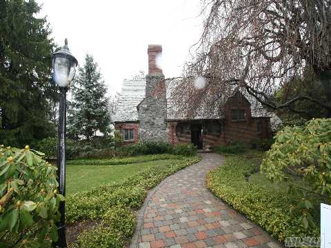 Beautiful Beacon Hill English  Tudor W/Spectacular Curb Appeal. Stunning Finishes Throughout, Lr W/Stone Fpl. Fam. Rm. Powder Rm, & Eik W/Private Cedar Deck, Mbr & Bath Plus 2 Additional Br's And Full Bath. Ground Level Basement Has A Private Entrance Leading To Br + Full Bath. Attached 2 Car Heated Garage. Mint !!