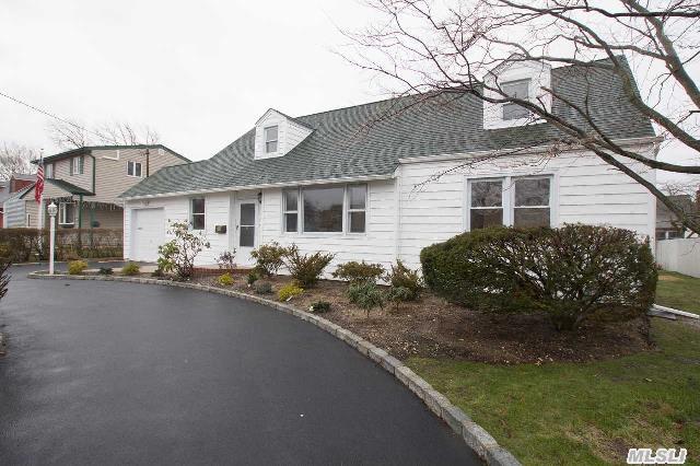 Completely Renovated Expanded Cape 1, 989 Sq Ft. Wonderful Mid-Block Location W/ Oversized Property And Private Yard. Light And Bright 4 Bds + New Stainless & Granite Eik W/Cherry Cabs & Center Island + Sitting/Dining Rm + 2 New Full Bths + Lrge Fmly Rm W/Gas Fplc + Lndry Rm + Att Gar With Attic. New Appls,  Gas Burner,  Water Heater,  Oak Floors & Cac. Ig Sprkls,  Walk To Rr.